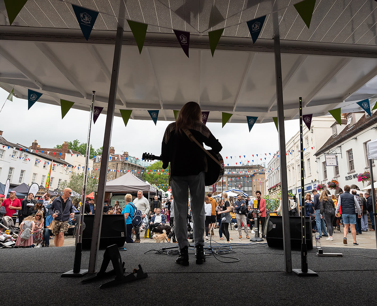 A performer on stage in front of a crowd